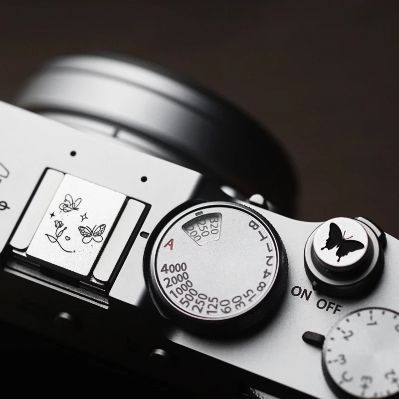 Fujifilm Camera X100Vi - غطاء معدني لفتحة الكاميرا مع زر